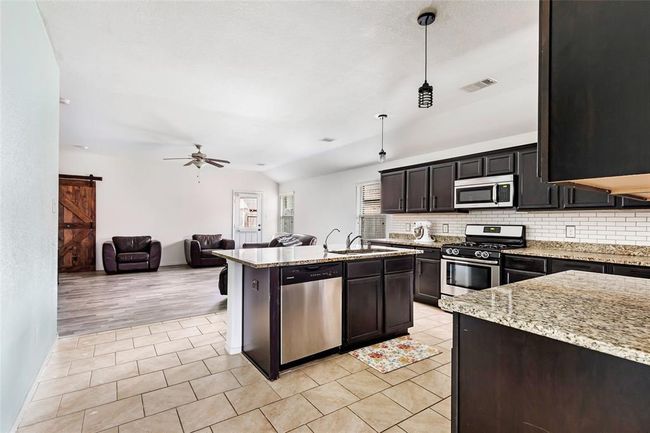 Great flooring, open concept living. | Image 13