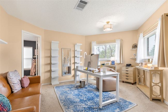 Primary bedroom sitting area or office | Image 16
