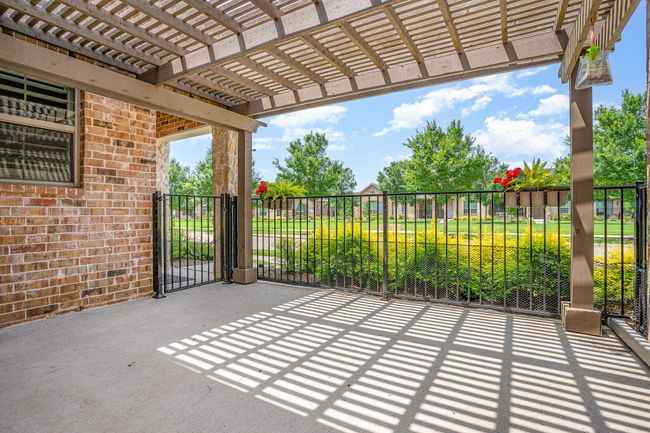 View of front patio featuring a pergola and views to north greenbelt | Image 26