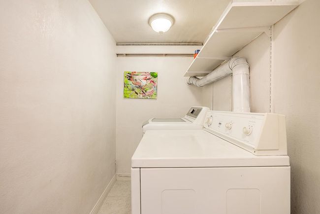 Washroom featuring independent washer and dryer and baseboards | Image 32