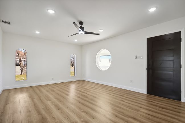 Spare room featuring light wood finished floors, visible vents, a ceiling fan, and recessed lighting | Image 6