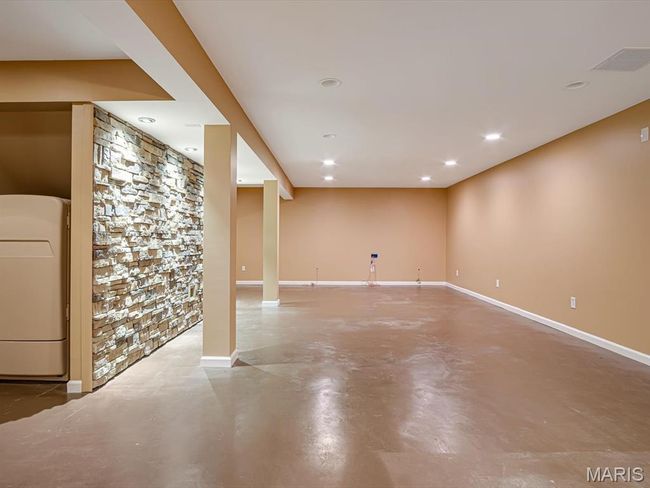 Stone accent wall with gas hook up for future use. | Image 25