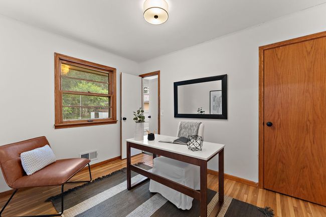 This third main level bedroom can serve as a dining room. | Image 12