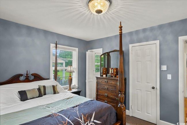 Bedroom with baseboards and carpet flooring | Image 14