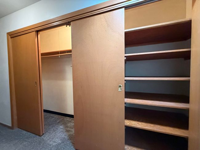 Main Floor Hallway Large Storage Closets with built-in shelving. | Image 12