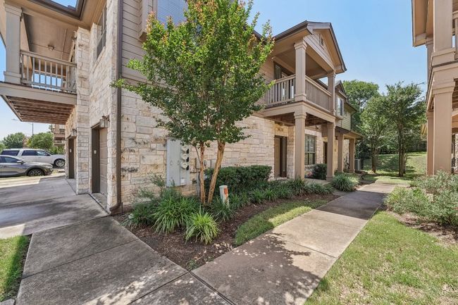 Charming Entry – Mature trees and peaceful surroundings greet you at your front door. | Image 9
