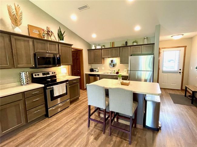 Vaulted ceilings make it feel even more spacious! | Image 7