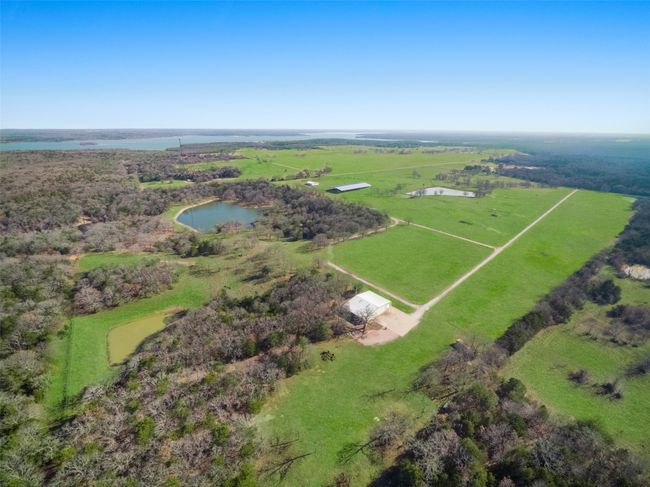 From NW edge of property. Grass airstrip runs parallel to drive, on right side of picture | Image 13