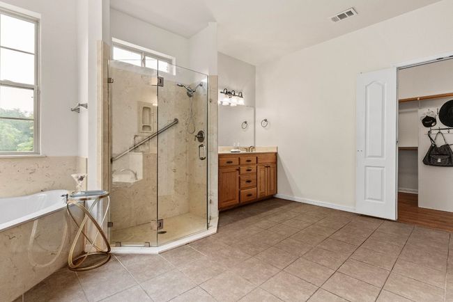 Full bath with visible vents, a shower stall, vanity, and a healthy amount of sunlight | Image 27
