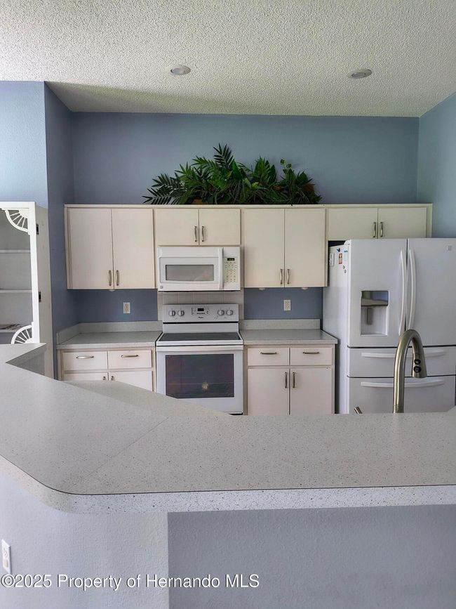 New brushed nickel hardware on Cabinets | Image 8