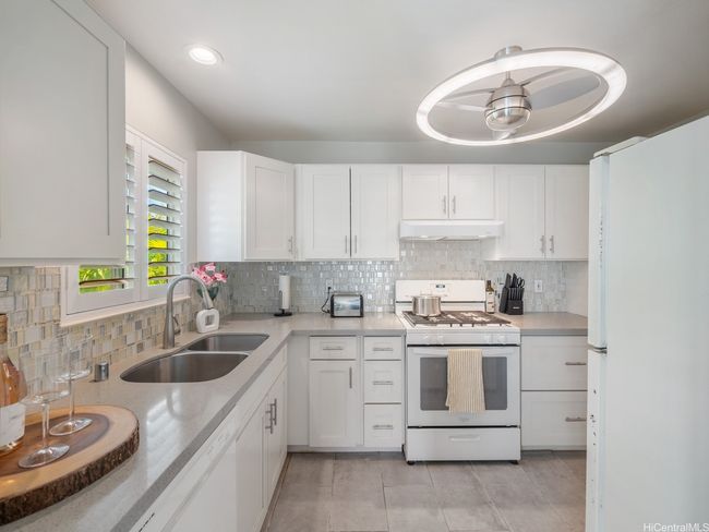 Kitchen with gas range and quartz counters | Image 10