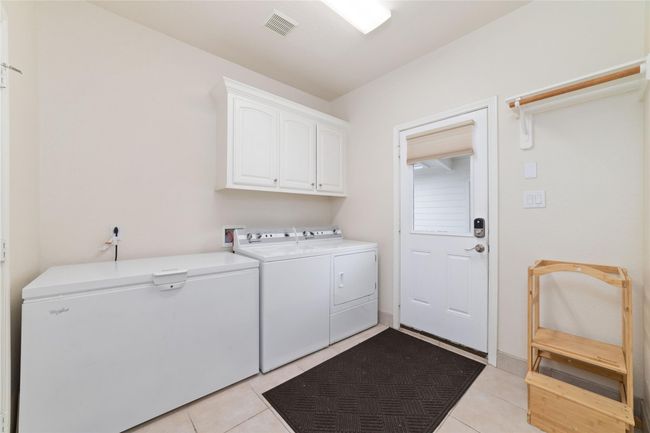 Laundry room with extra space and a half path. | Image 34