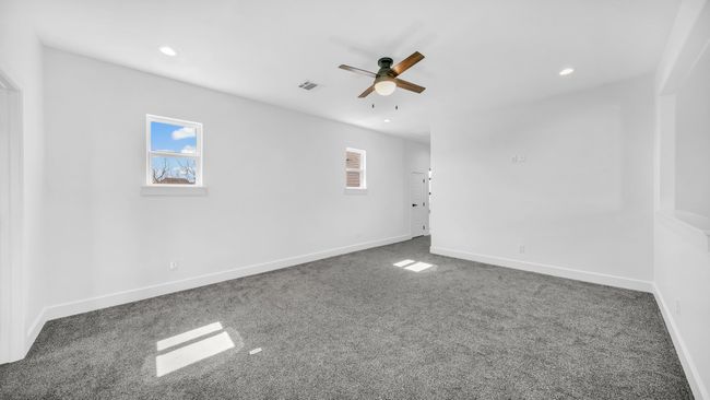 Empty room featuring visible vents, a ceiling fan, recessed lighting, carpet flooring, and baseboards | Image 28