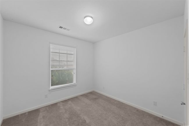 Empty room featuring carpet and baseboards | Image 23