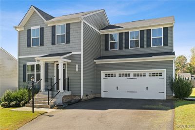 View of front facade featuring a garage | Image 2