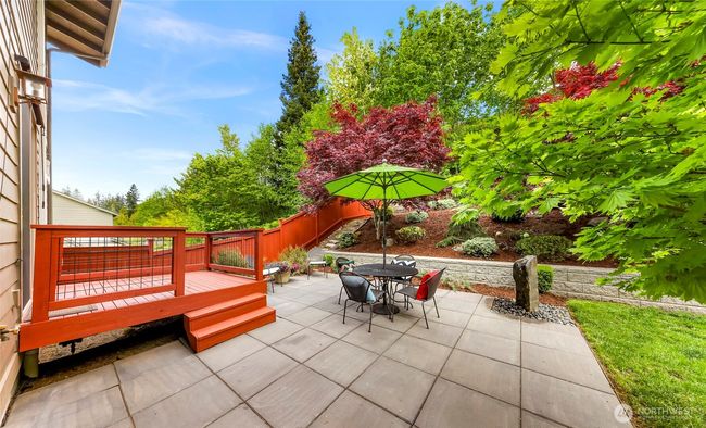 Freshly painted deck and fence. | Image 29