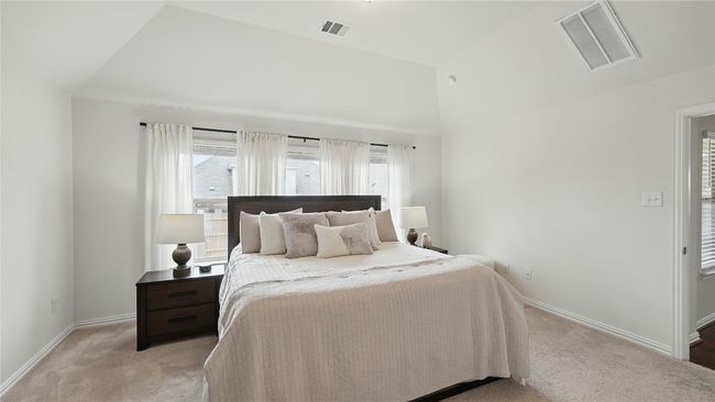 Bedroom with light colored carpet and vaulted​​‌​​​​‌​​‌‌​‌‌​​​‌‌​​‌‌​‌​​​​​‌ ceiling | Image 25