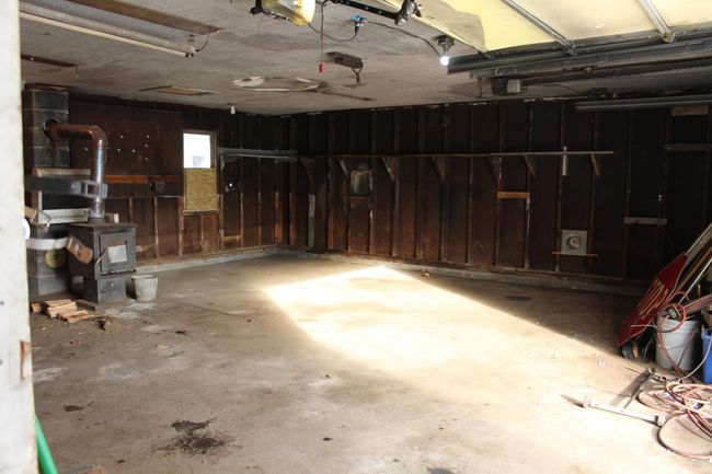 back storage shed attached off this 2 car garage & work shop area | Image 45