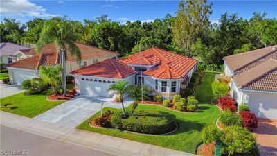 View of front of property with a garage and a front lawn | Image 2