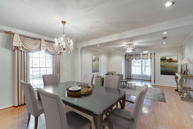 Dining room and living area at the front of the home. There are limitless possibilities for this space! | Image 7