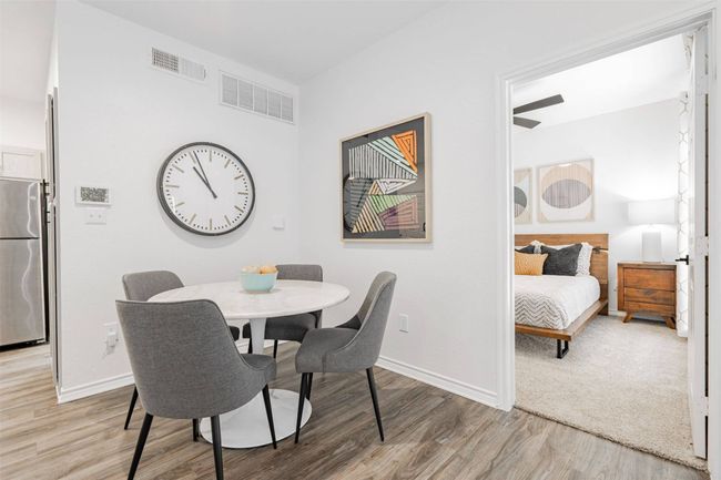 Dining space featuring light hardwood / wood-style floors and ceiling fan | Image 11