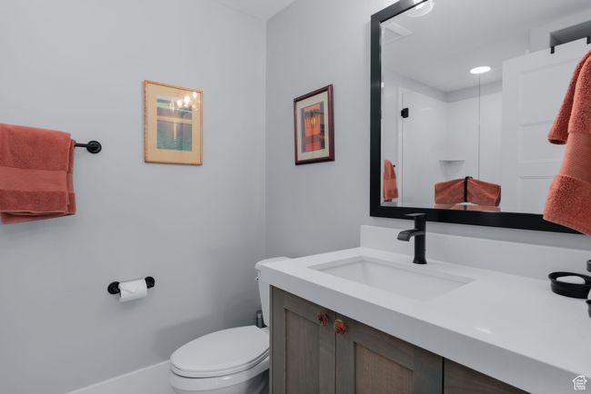 Full bathroom featuring vanity, toilet, and a stall shower | Image 32