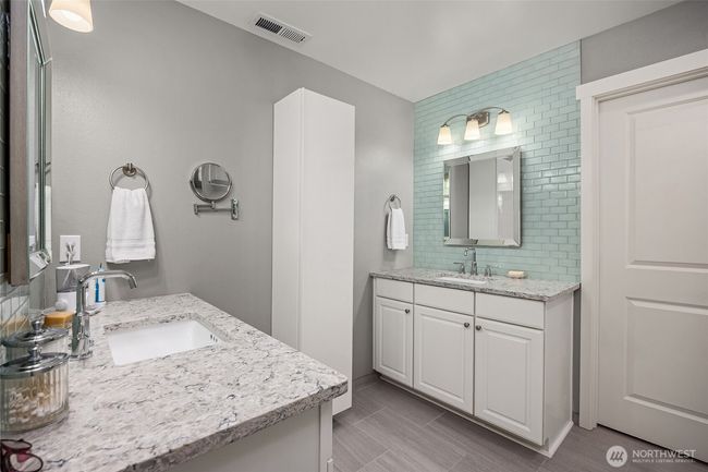 Primary bathroom offers great storage and is inviting | Image 20