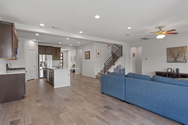 Open concept layout with wood look tile throughout | Image 5