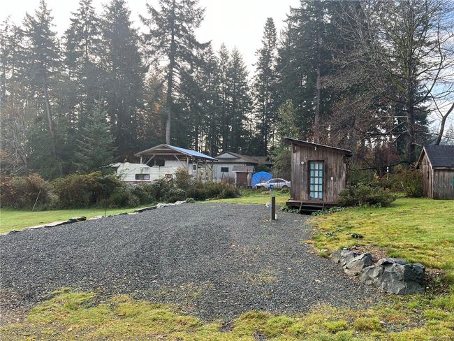 level RV parking area next to shed with full hookups in place | Image 14