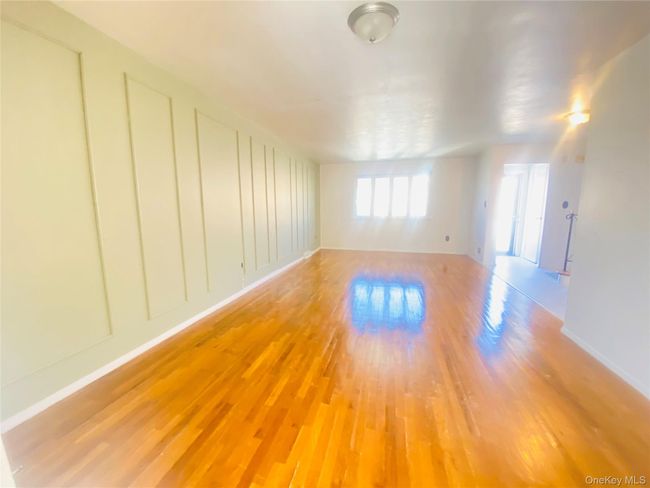 Kitchen with light countertops, white appliances, light brown cabinetry, and ceiling fan | Image 13