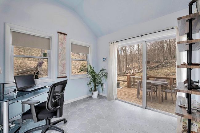 Den/Office space with baseboards, vaulted ceiling, tile patterned flooring, and plenty of natural light | Image 10