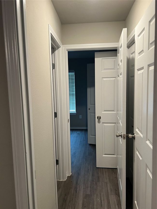 Hallway with dark wood-type flooring | Image 11