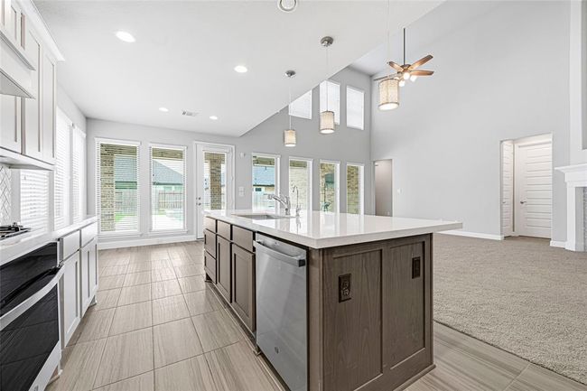 There are 4 electric outlets surrounding the kitchen island. What a view. | Image 11