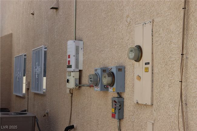 Exterior view of related energy utilities and stucco siding | Image 9
