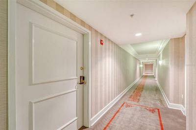 Unit entry at the end of the hallway on the right | Image 3