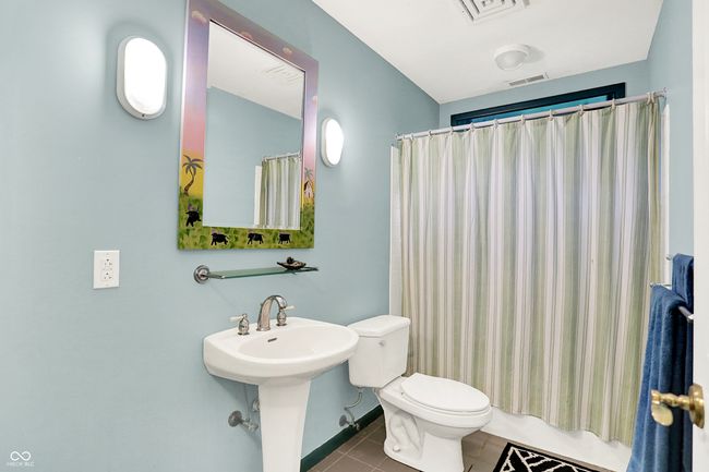 Full bathroom with tile patterned flooring and a shower | Image 10