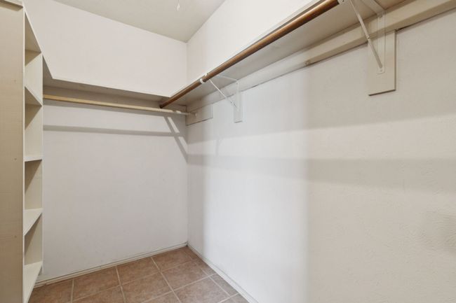 Walk in closet with light tile patterned floors | Image 22