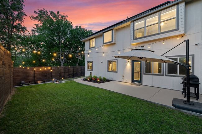 Wrap around back yard is perfect for relaxing on the large patio, tiered yard with sidewalk, privacy fencing and three gates. | Image 27