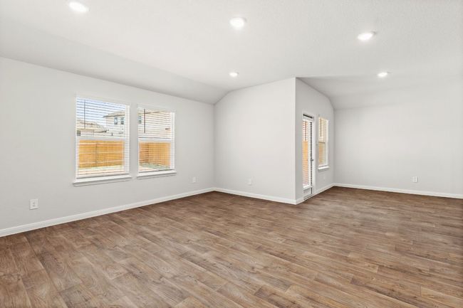 Living room with recessed lighting, and back yard access. | Image 7