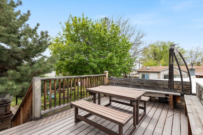 Wooden deck featuring outdoor dining space | Image 17