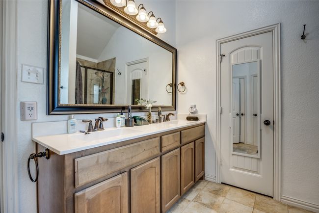 Bathroom with an enclosed shower, vanity, and vaulted ceiling | Image 15