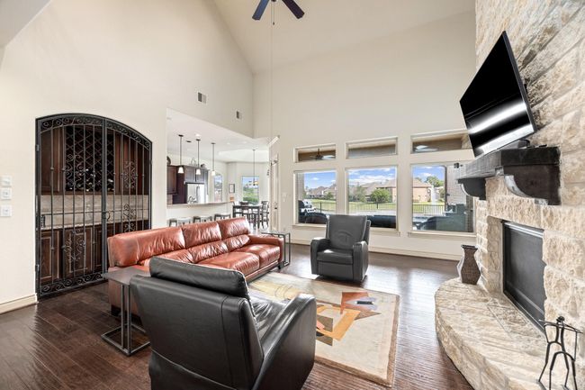 Another view of the main living room with the kitchen & breakfast area in the background. | Image 12