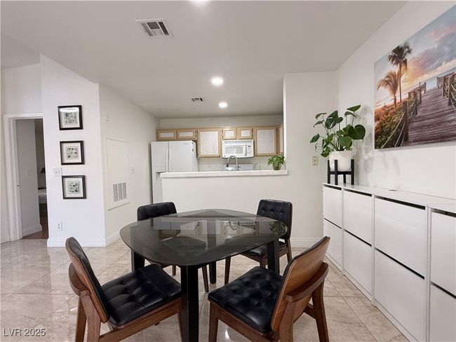 Dining room with baseboards, visible vents, and recessed lighting | Image 16