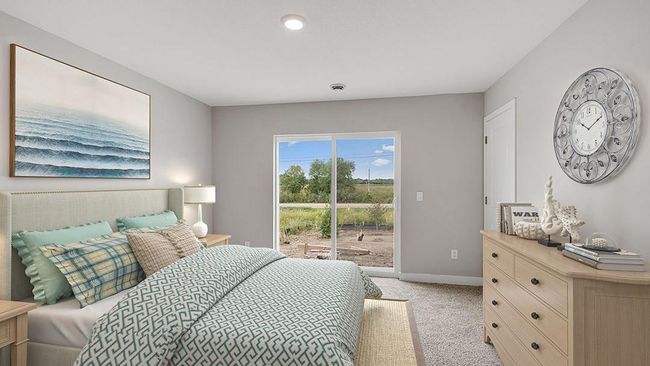 The primary suite opens to a spacious patio! Photo of actual home! | Image 7