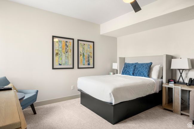Bedroom featuring light carpet and baseboards | Image 32