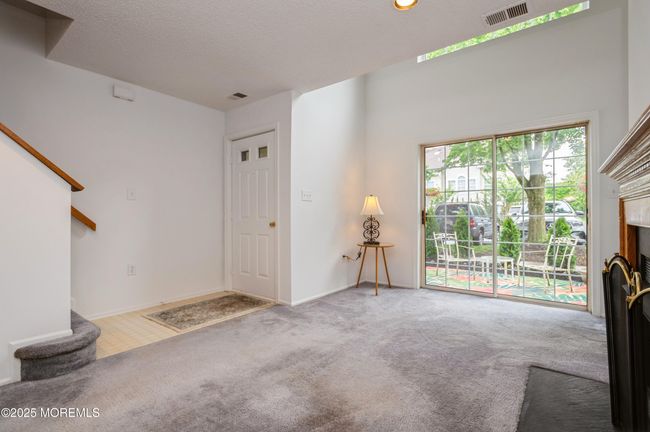 Living area looking to sliding door to your patio | Image 5