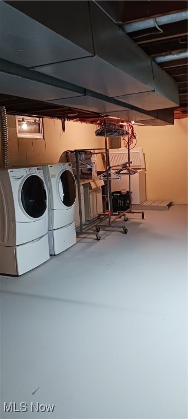 Basement featuring washing machine and dryer | Image 33
