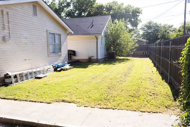 View of fenced backyard | Image 29