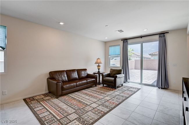 Living room featuring light tile patterned floors, baseboards, and recessed lighting | Image 6