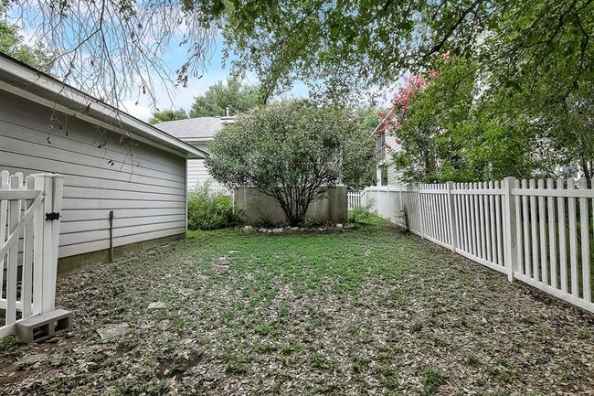 View of fenced backyard | Image 30